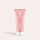 Intimate Pre-Shave Peeling in der rosa Tube mit weißer Kappe, aus der Glow-Below-Linie von juno&me