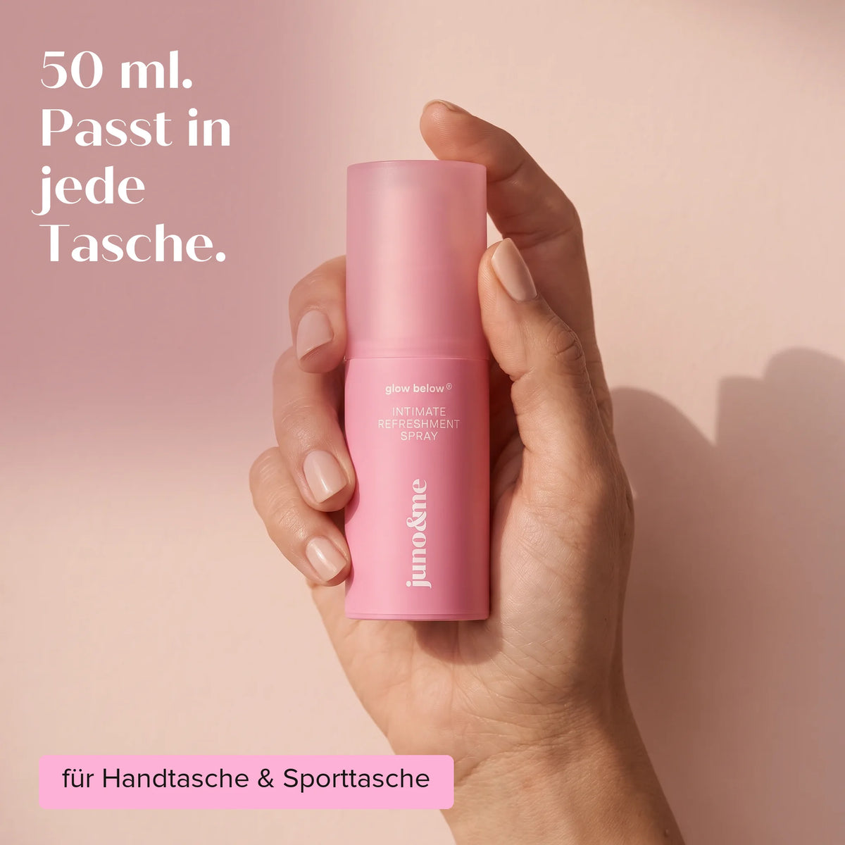 Hand holding the 50 ml Intim Deo, fits in every bag, juno&me