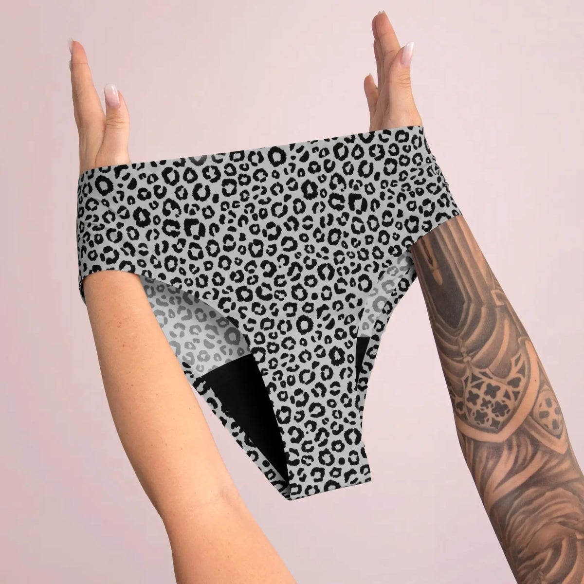 Leo Seamless Slip in anthracite held up with both hands, black absorbent gusset visible, juno&me