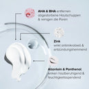 Wirkstoffe im Clarifying Body Duo: weiße Lotion-Textur in einer Glasschale mit AHA, BHA, Zink, Allantoin und Panthenol